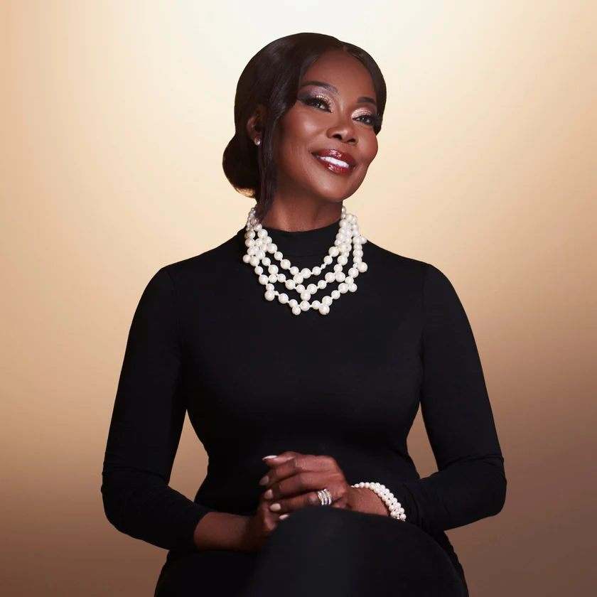 Smiling woman in elegant black dress